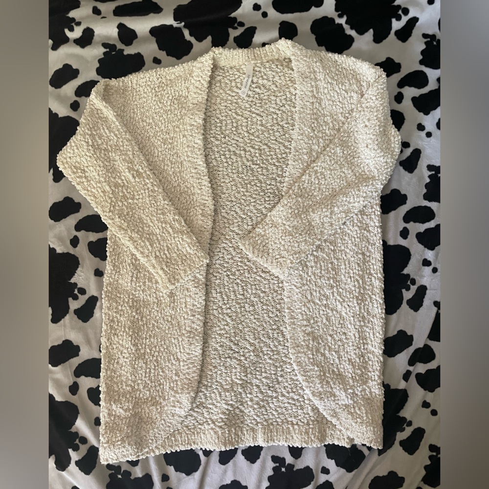 White cardigan with gold accents